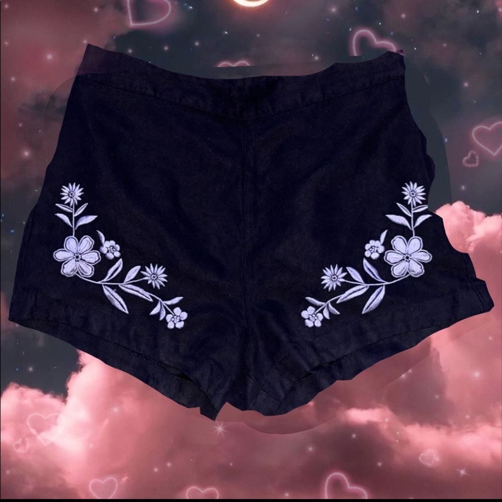 Black Hollister jean shorts with white floral pattern flowers